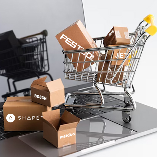 Shopping cart on a laptop filled with boxes of different power tool brands 